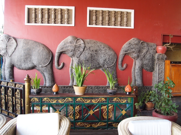 elephants march through the restaurant