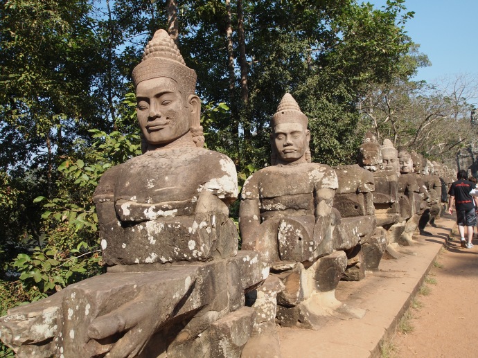 some of the 54 gods leading to angkor thom's east gate